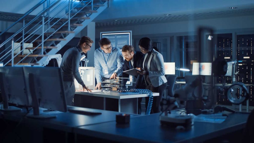 Team,Of,Electronics,Development,Engineers,Standing,At,The,Desk,With