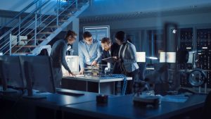 Team,Of,Electronics,Development,Engineers,Standing,At,The,Desk,With